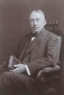 Dr Charles Caverly